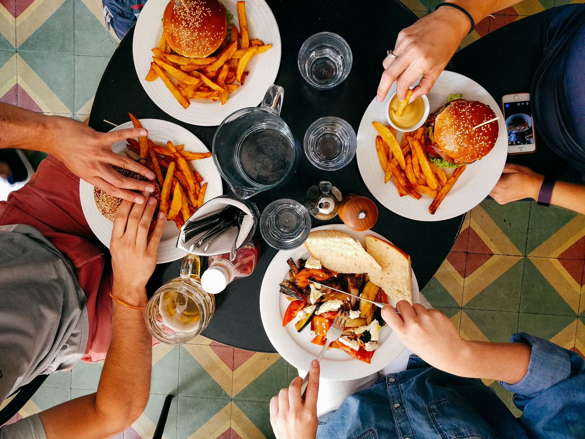 Diners enjoying burgers and fries
