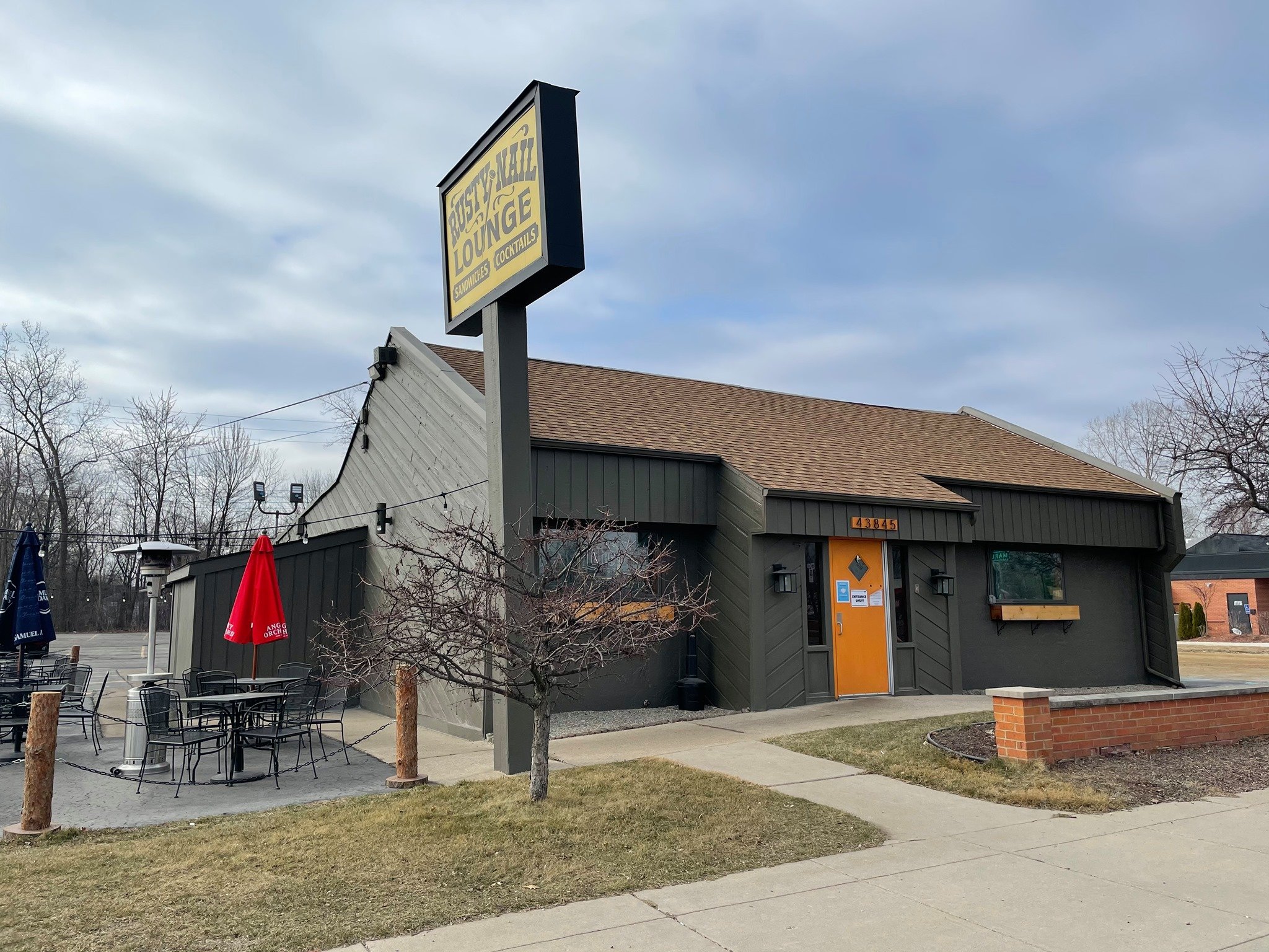 Restaurant storefront with a large pylon sign
