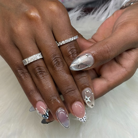 Hands showing off silver nail treatment